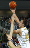 Damir Markota (no.22) of Union Olimpija (R) shooting over Branislav Dekic (no.31) of Partizan mts (L) during match of NLB Adriatic basketball League between Union Olimpija and Partizan. Match of NLB Adriatic basketball League between Union Olimpija, Ljubljana, Slovenia and Partizan, Belgrade, Serbia was played in Stozice Arena, Ljubljana, Slovenia, on Sunday, 31st of October 2010.
