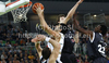 Giorgi Shermadini (no.16) of Union Olimpija (R) scoring over Rasko Katic (no.14) of Partizan mts (L) during match of NLB Adriatic basketball League between Union Olimpija and Partizan. Match of NLB Adriatic basketball League between Union Olimpija, Ljubljana, Slovenia and Partizan, Belgrade, Serbia was played in Stozice Arena, Ljubljana, Slovenia, on Sunday, 31st of October 2010.

