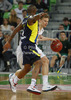 Teemu Rannikko (no.9) of Union Olimpija (R) and Bo McCalebb (no.4) of Fenerbahce Ulker (L) during Turkish Airlines Euroleague basketball match of second round between Union Olimpija, Ljubljana, Slovenia and Fenerbahce Ulker, Istanbul, Turkey. Match between Union Olimpija and Fenerbahce Ulker was played in in Stozice Arena in Ljubljana, Slovenia, on Friday, 19th of October 2012.
