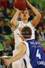 Teemu Rannikko (no.9) of Union Olimpija shooting over Jakub Kudlacek (no.4) of Mapooro Cantu during Turkish Airlines Euroleague basketball match of sixth round between Union Olimpija, Ljubljana, Slovenia and Mapooro Cantu, Italy. Match between Union Olimpija and Mapooro Cantu was played in in Stozice Arena in Ljubljana, Slovenia, on Thursday, 15th of November 2012.
