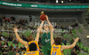 Jaka Blazic (no.8) of Union Olimpija (M) scoring over Kelvin Rivers (no.11) of BC Khimki Moscow (L) and Matt Nielsen (no.44) of BC Khimki Moscow (R) during Turkish Airlines Euroleague basketball match of sixth round between Union Olimpija, Ljubljana, Slovenia and BC Khimki Moscow, Russia. Match between Union Olimpija and BC Khimki Moscow was played in in Stozice Arena in Ljubljana, Slovenia, on Friday, 7th of December 2012.

