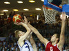 Kimmo Muurinen (no.6) of Finland (L) shooting over Sergey Monya (no.12) of Russia (R) during FIBA European basketball championships 2013 match between Finland and Russia. Match between Finland and Russia was played on Sunday, 8th of September 2013 in Bonifika arena in Koper, Slovenia.
