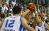 Roope Ahonen (no.14) of Finland (M) shooting over Loukas Mavrokefalidis (no.12) of Greece (L) during FIBA European basketball championships 2013 match between Finland and Greece. Match between Finland and Greece was played on Monday, 9th of September 2013 in Bonifika arena in Koper, Slovenia.
