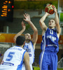 Petteri Koponen (no.11) of Finland (R) scoring for 3 points oner Yannis Bourousis (no.5) of Greece (L) while Michail Bramos (no.14) of Greece (M) is trying to block him during FIBA European basketball championships 2013 match between Finland and Greece. Match between Finland and Greece was played on Monday, 9th of September 2013 in Bonifika arena in Koper, Slovenia.
