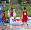 Luka Zoric (no.14) of Croatia (M) jumping for rebound ball with Kimmo Muurinen (no.6) of Finland (L) and Shawn Huff (no.7) of Finland (R) during FIBA European Basketball championships 2013 match of second round between Finland and Croatia. Match between Finland and Croatia was played on Thursday, 12th of September 2013 in Stozice arena in Ljubljana, Slovenia.
