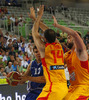 Samuel Haanpaa (no.12) of Finland (L) attacking next to German Gabriel (no.14) of Spain (M) and Marc Gasol (no.13) of Spain (R) during FIBA European basketball championships 2013 match of second round between Finland and Spain. Match between Finland and Spain was played on Saturday, 14th of September 2013 in Stozice arena in Ljubljana, Slovenia.
