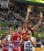 Linas Kleiza (no.11) of Lithuania (R) trying to shoot over Damir Markota (no.12) of Croatia (L) and Ante Tomic (no.4) of Croatia (M) during FIBA European basketball championships 2013 half final match between Croatia and Lithuania. Half final match of FIBA European basketball championships 2013 between Croatia and Lithuania was played on Friday, 20th of September 2013 in Stozice arena in Ljubljana, Slovenia.
