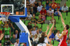 Bojan Bogdanovic (no.7) of Croatia (R) shooting over Linas Kleiza (no.11) of Lithuania (L) and  Mindaugas Kuzminskas (no.6) of Lithuania (M) during FIBA European basketball championships 2013 half final match between Croatia and Lithuania. Half final match of FIBA European basketball championships 2013 between Croatia and Lithuania was played on Friday, 20th of September 2013 in Stozice arena in Ljubljana, Slovenia.
