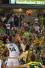 Alexis Ajinca (no.14) of France (L) jumping for first ball during FIBA European basketball championships 2013 final match between France and Lithuania. Final match of FIBA European basketball championships 2013 between France and Lithuania was played on Sunday, 22nd of September 2013 in Stozice arena in Ljubljana, Slovenia.
