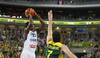 Mickael Gelabale (no.15) of France (L) shooting over Darjus Lavrinovic (no.7) of Lithuania (R) during FIBA European basketball championships 2013 final match between France and Lithuania. Final match of FIBA European basketball championships 2013 between France and Lithuania was played on Sunday, 22nd of September 2013 in Stozice arena in Ljubljana, Slovenia.
