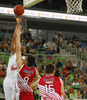 Kodi Augustus (no.24) of Union Olimpija (L) shooting over Luka Mitrovic (no.9) of Crvena Zvezda (R) during match of 4th round of ABA Basketball League between Union Olimpija, Slovenia, and Crvena Zvezda, Serbia. Match of ABA Basketball League between Union Olimpija, Slovenia, and Crvena Zvezda, Serbia, was played on Sunday, 20th of October 2013 in Stozice arena in Ljubljana, Slovenia.
