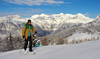 Ski tourer during ski tour in Velika Planina above Kamnik, Slovenia on sunny Saturday, 20th of February 2016.
