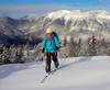 Ski tourer during ski tour in Velika Planina above Kamnik, Slovenia on sunny Saturday, 20th of February 2016.
