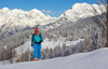 Ski tourer during ski tour in Velika Planina above Kamnik, Slovenia on sunny Saturday, 20th of February 2016.
