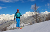 Ski tourer during ski tour in Velika Planina above Kamnik, Slovenia on sunny Saturday, 20th of February 2016.
