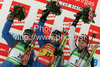 Winner Helena Jonsson of Sweden (M), second placed Anna Carin Olofsson-Zidek of Sweden (L) and third placed Anastasiya Kuzmina of Slovakia (R) celebrating their medals won in women 15km individual race of e.on Ruhrgas IBU Biathlon World Cup 2009-10. Women individual race of e.on Ruhrgas IBU Biathlon World Cup was held in Pokljuka, Slovenia, on 17th of December 2009.

