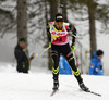 Martin Fourcade of France competes during men IBU E.on Biathlon World cup sprint race in Pokljuka, Slovenia. Men sprint race of IBU E.on Biathlon World cup was held on Thursday, 6th of March 2014 in Pokljuka, Slovenia.
