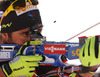 Second placed Martin Fourcade of France shooting during men IBU E.on Biathlon World cup mass start race in Pokljuka, Slovenia. 15km long men mass start race of IBU E.on Biathlon World cup was held on Sunday, 9th of March 2014 in Pokljuka, Slovenia.
