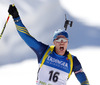 Winner Bjoern Ferry of Sweden celebrates his victory crossing finish line during men IBU E.on Biathlon World cup mass start race in Pokljuka, Slovenia. 15km long men mass start race of IBU E.on Biathlon World cup was held on Sunday, 9th of March 2014 in Pokljuka, Slovenia.
