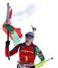 Winner Darya Domracheva of Belarus celebrates her victory crossing finish line during women IBU E.on Biathlon World cup mass start race in Pokljuka, Slovenia. 12.5km long women mass start race of IBU E.on Biathlon World cup was held on Sunday, 9th of March 2014 in Pokljuka, Slovenia.
