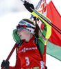 Winner Darya Domracheva of Belarus celebrates her victory crossing finish line during women IBU E.on Biathlon World cup mass start race in Pokljuka, Slovenia. 12.5km long women mass start race of IBU E.on Biathlon World cup was held on Sunday, 9th of March 2014 in Pokljuka, Slovenia.
