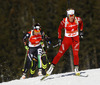 Tiril Eckhoff of Norway and Dorothea Wierer of Italy competes during women IBU E.on Biathlon World cup mass start race in Pokljuka, Slovenia. 12.5km long women mass start race of IBU E.on Biathlon World cup was held on Sunday, 9th of March 2014 in Pokljuka, Slovenia.
