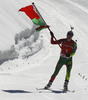 Winner Darya Domracheva of Belarus celebrates her victory crossing finish line during women IBU E.on Biathlon World cup mass start race in Pokljuka, Slovenia. 12.5km long women mass start race of IBU E.on Biathlon World cup was held on Sunday, 9th of March 2014 in Pokljuka, Slovenia.

