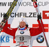 Winner Johannes Thingnes Boe of Norway celebrates his medal won in Men sprint race of IBU Biathlon World Cup in Hochfilzen, Austria. Men sprint race of IBU Biathlon World cup was held on Friday, 12th of December 2014 in Hochfilzen, Austria.
