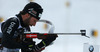 Serafin Wiestner of Switzerland getting ready for shooting during Men relay race of IBU Biathlon World Cup in Hochfilzen, Austria. Men relay race of IBU Biathlon World cup was held on Saturday, 13th of December 2014 in Hochfilzen, Austria.
