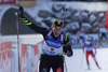 Third placed Anais Bescond of France celebrating when crossing finish line in the Women pursuit race of IBU Biathlon World Cup in Hochfilzen, Austria. Women pursuit race of IBU Biathlon World cup was held on Sunday, 14th of December 2014 in Hochfilzen, Austria.
