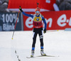 Winner Kaisa Makarainen of Finland celebrating her victory when crossing finish line of the Women pursuit race of IBU Biathlon World Cup in Hochfilzen, Austria. Women pursuit race of IBU Biathlon World cup was held on Sunday, 14th of December 2014 in Hochfilzen, Austria.
