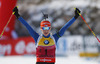 Winner Kaisa Makarainen of Finland celebrating her victory when crossing finish line of the Women pursuit race of IBU Biathlon World Cup in Hochfilzen, Austria. Women pursuit race of IBU Biathlon World cup was held on Sunday, 14th of December 2014 in Hochfilzen, Austria.
