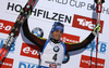Simon Schempp of Germany celebrates his medal won in the Men sprint race of IBU Biathlon World Cup in Hochfilzen, Austria. Men sprint race of IBU Biathlon World cup was held on Friday, 11th of December 2015 in Hochfilzen, Austria.
