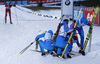 Team of Russia with Alexey Volkov, Evgeniy Garanichev, Dmitry Malyshko and Anton Shipulin celebrating in finish area while Emil Hegle Svendsen of Norway is exhausted and disappointed in background during the Men relay race of IBU Biathlon World Cup in Hochfilzen, Austria. Men relay race of IBU Biathlon World cup was held on Sunday, 13th of December 2015 in Hochfilzen, Austria.
