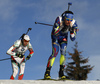 Dimitar Gerdzhikov of Bulgaria (L) and Quentin Fillion Maillet of France skiing during the Men relay race of IBU Biathlon World Cup in Hochfilzen, Austria. Men relay race of IBU Biathlon World cup was held on Sunday, 13th of December 2015 in Hochfilzen, Austria.

