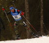 Winner Simon Schempp of Germany skiing during the Men sprint race of IBU Biathlon World Cup in Pokljuka, Slovenia. Men sprint race of IBU Biathlon World cup was held on Thursday, 17th of December 2015 in Pokljuka, Slovenia.
