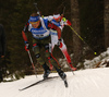 Erik Lesser of Germany skiing during the Men sprint race of IBU Biathlon World Cup in Pokljuka, Slovenia. Men sprint race of IBU Biathlon World cup was held on Thursday, 17th of December 2015 in Pokljuka, Slovenia.
