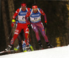 Emil Hegle Svendsen of Norway (L) and Tim Burke of USA skiing during the Men sprint race of IBU Biathlon World Cup in Pokljuka, Slovenia. Men sprint race of IBU Biathlon World cup was held on Thursday, 17th of December 2015 in Pokljuka, Slovenia.

