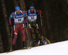 Maxim Tsvetkov of Russia (L) and Simon Schempp of Germany skiing during the Men sprint race of IBU Biathlon World Cup in Pokljuka, Slovenia. Men sprint race of IBU Biathlon World cup was held on Thursday, 17th of December 2015 in Pokljuka, Slovenia.
