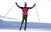 Winner Simon Schempp of Germany crossing finish line and celebrating his victory in the Men pursuit race of IBU Biathlon World Cup in Pokljuka, Slovenia. Men pursuit race of IBU Biathlon World cup was held on Saturday, 19th of December 2015 in Pokljuka, Slovenia.
