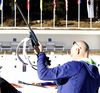 Finnish coach Marko Laaksonen trying to solve problems on Kaisa Makarainen rifle during zeroing before start of the Women pursuit race of IBU Biathlon World Cup in Pokljuka, Slovenia. Women pursuit race of IBU Biathlon World cup was held on Saturday, 19th of December 2015 in Pokljuka, Slovenia.
