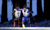 Second placed Marie Dorin Habert of France (front) and winner Laura Dahlmeier of Germany (back) skiing in the Women pursuit race of IBU Biathlon World Cup in Pokljuka, Slovenia. Women pursuit race of IBU Biathlon World cup was held on Saturday, 19th of December 2015 in Pokljuka, Slovenia.
