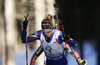 Second placed Marie Dorin Habert of France (front) and winner Laura Dahlmeier of Germany (back) skiing in the Women pursuit race of IBU Biathlon World Cup in Pokljuka, Slovenia. Women pursuit race of IBU Biathlon World cup was held on Saturday, 19th of December 2015 in Pokljuka, Slovenia.
