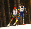 Marie Dorin Habert of France (R) and Laura Dahlmeier of Germany (L) skiing during the Women pursuit race of IBU Biathlon World Cup in Pokljuka, Slovenia. Women pursuit race of IBU Biathlon World cup was held on Saturday, 19th of December 2015 in Pokljuka, Slovenia.
