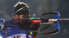Winner Jean Guillaume Beatrix of France shooting in the Men mass start race of IBU Biathlon World Cup in Pokljuka, Slovenia. Men mass start race of IBU Biathlon World cup was held on Sunday, 20th of December 2015 in Pokljuka, Slovenia.
