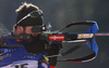 Winner Jean Guillaume Beatrix of France shooting in the Men mass start race of IBU Biathlon World Cup in Pokljuka, Slovenia. Men mass start race of IBU Biathlon World cup was held on Sunday, 20th of December 2015 in Pokljuka, Slovenia.

