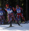 Second placed Emil Hegle Svendsen of Norway (back) following Evgeniy Garanichev of Russia (front) during in the Men mass start race of IBU Biathlon World Cup in Pokljuka, Slovenia. Men mass start race of IBU Biathlon World cup was held on Sunday, 20th of December 2015 in Pokljuka, Slovenia.

