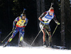 Martin Fourcade of France (L) and Benedikt Doll of Germany (R) skiing in the Men mass start race of IBU Biathlon World Cup in Pokljuka, Slovenia. Men mass start race of IBU Biathlon World cup was held on Sunday, 20th of December 2015 in Pokljuka, Slovenia.

