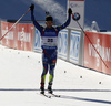 Winner Jean Guillaume Beatrix of France celebrates his victory crossing the finish line in the Men mass start race of IBU Biathlon World Cup in Pokljuka, Slovenia. Men mass start race of IBU Biathlon World cup was held on Sunday, 20th of December 2015 in Pokljuka, Slovenia.
