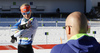 Kaisa Makarainen of Finland (L) and her coach Marko Laaksonen (R) during zeroing before start of the Women mass start race of IBU Biathlon World Cup in Pokljuka, Slovenia. Women mass start race of IBU Biathlon World cup was held on Sunday, 20th of December 2015 in Pokljuka, Slovenia.
